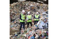 Workers in paper recycling factory.